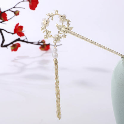 Houtinghua hairpin with floral, pearl and gold tassel, in light green vase