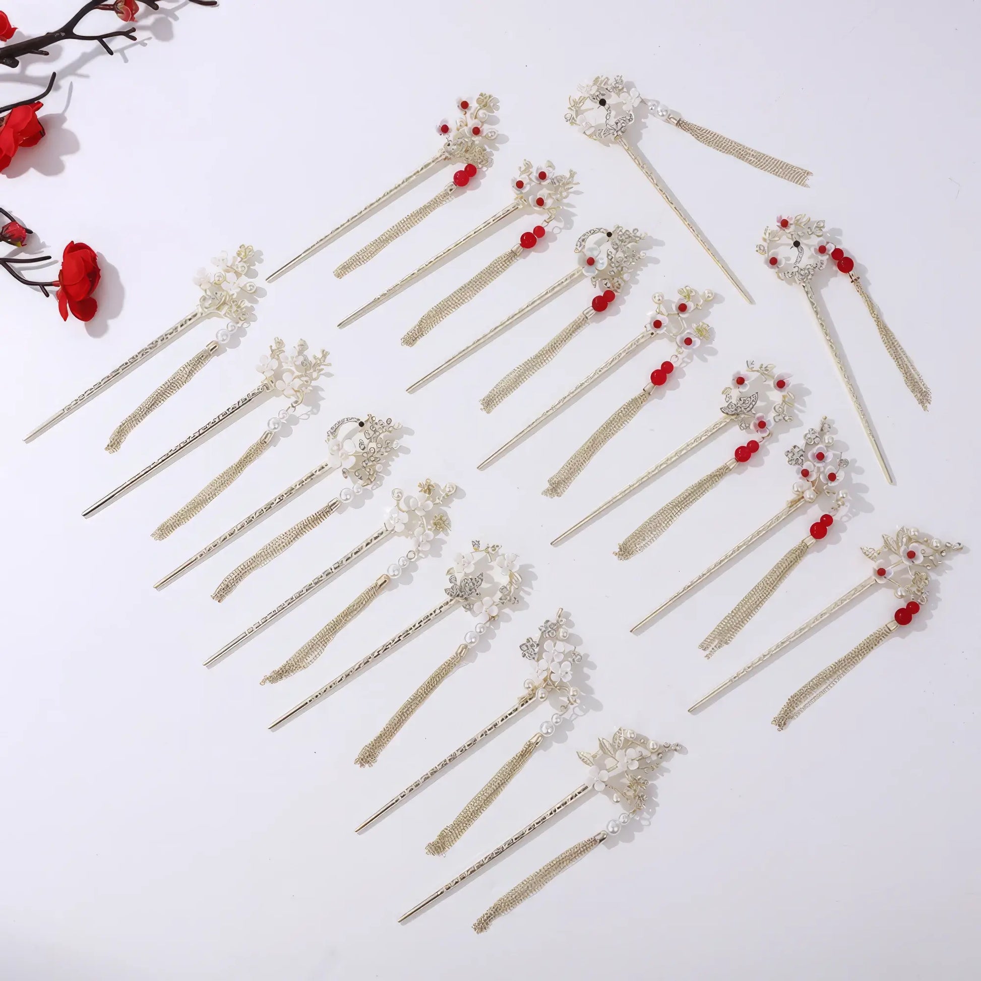 Set of Houtinghua hairpins with various floral and bead designs, gold tassels
