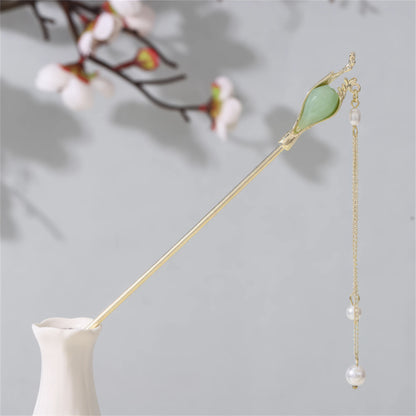 Jianjianjiao hairpin 2, gold rod with pearl and jade, in white vase against light gray background with plum blossoms
