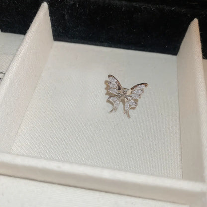 Another single multi - layer butterfly ear cuff in display box, detailed view