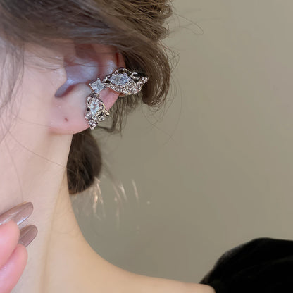 Side view of multi - layer butterfly ear cuff on ear, stylish and delicate