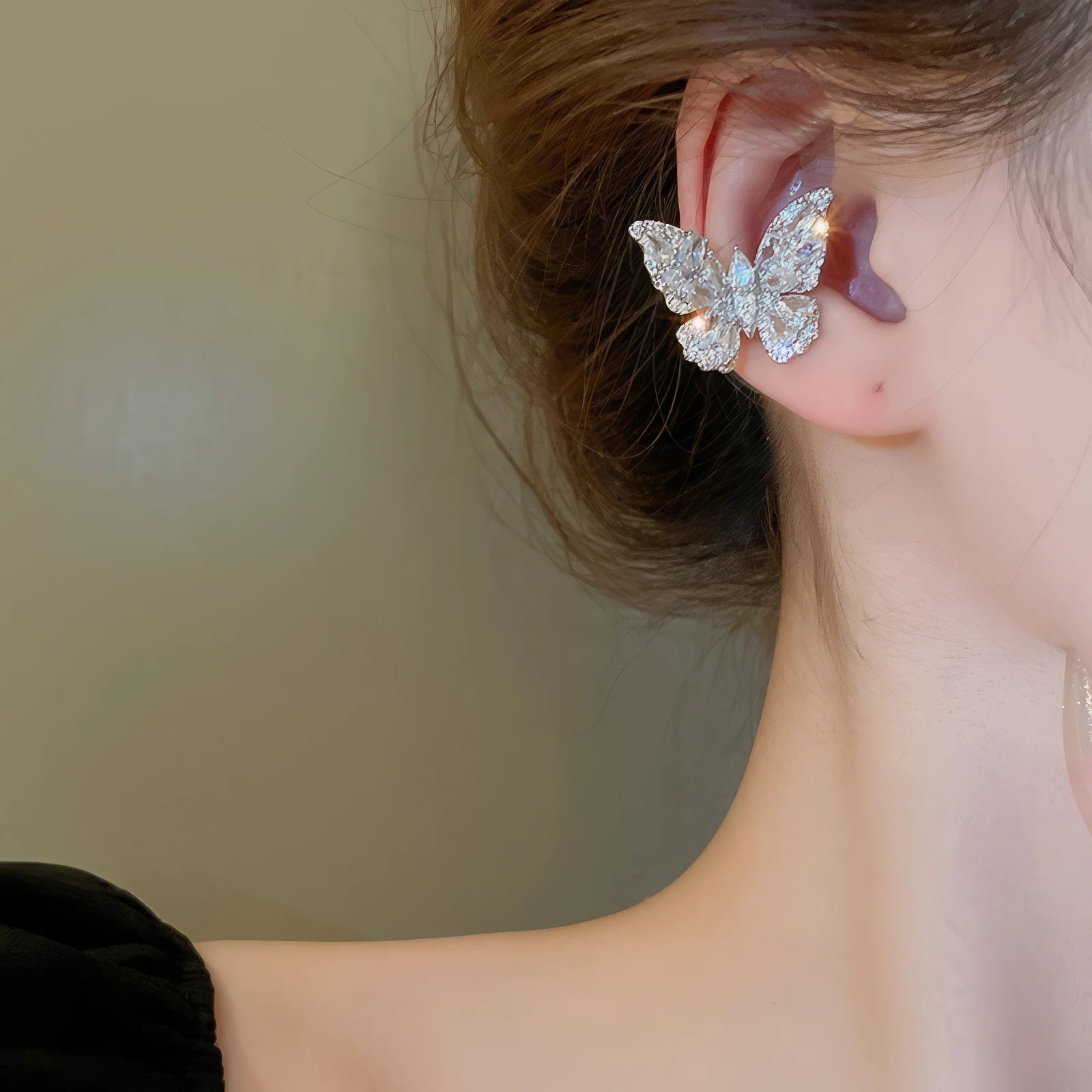 Multi - layer butterfly ear cuff, side - on ear view, elegant butterfly shape