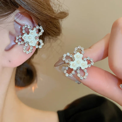 Multi - layer butterfly ear cuffs with flower - like design, held near ear