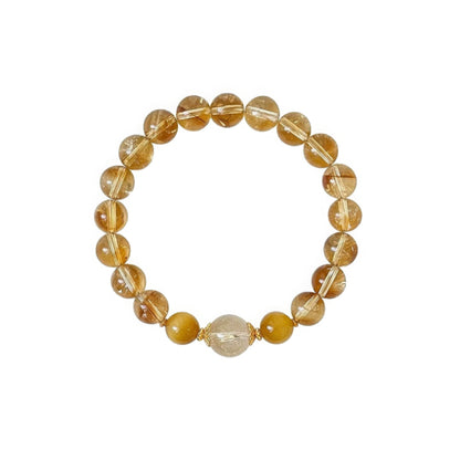 Natural stone citrine rutilated quartz bracelet, isolated on white background