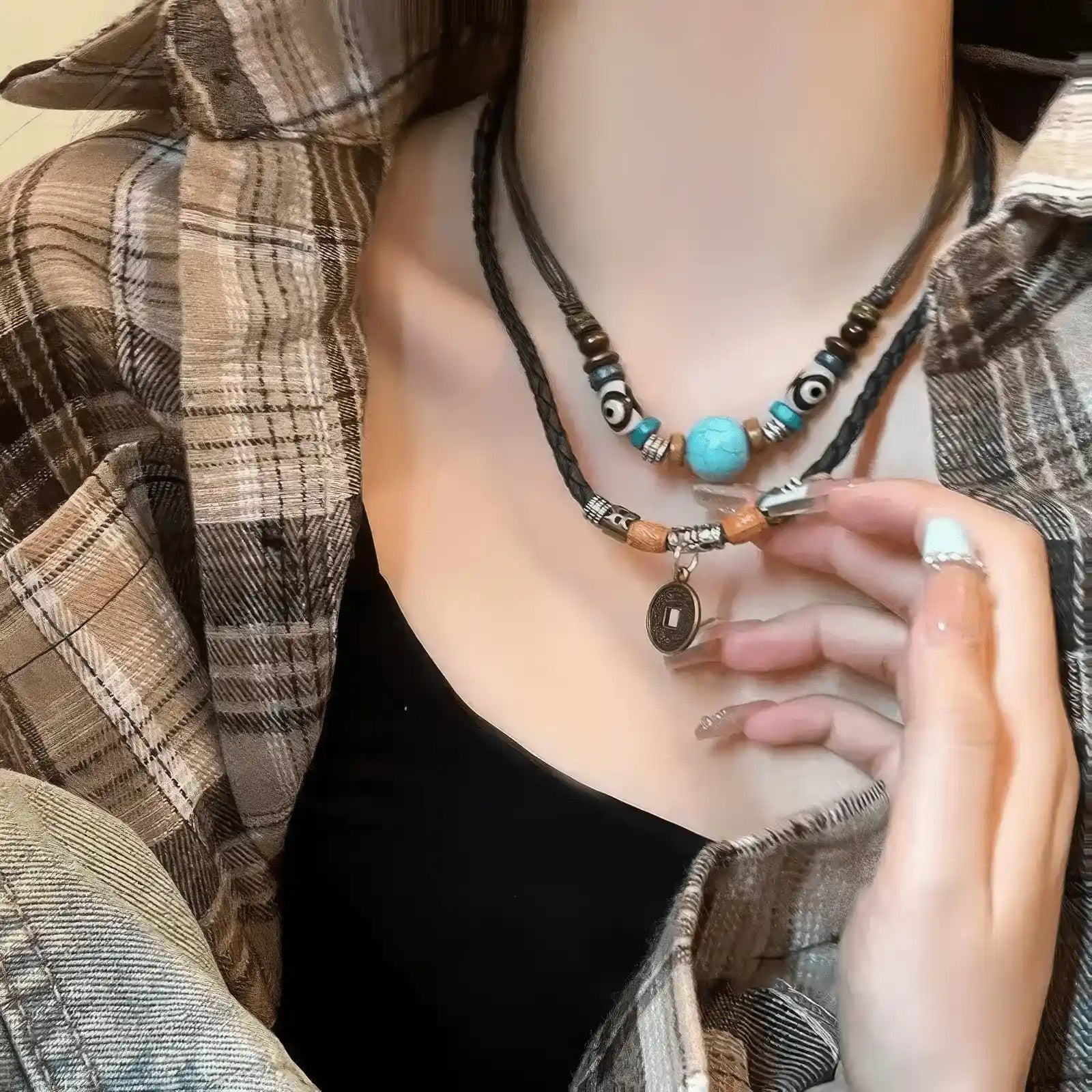 New Chinese ethnic style braided pendant necklaces worn, complementing a plaid shirt and black top, highlighting layered look