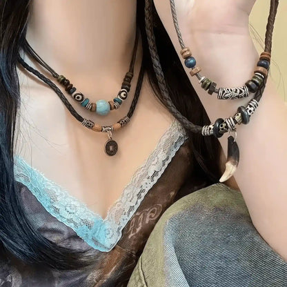 New Chinese ethnic style braided pendant necklaces worn, showcasing colorful beads and pendants with a unique outfit