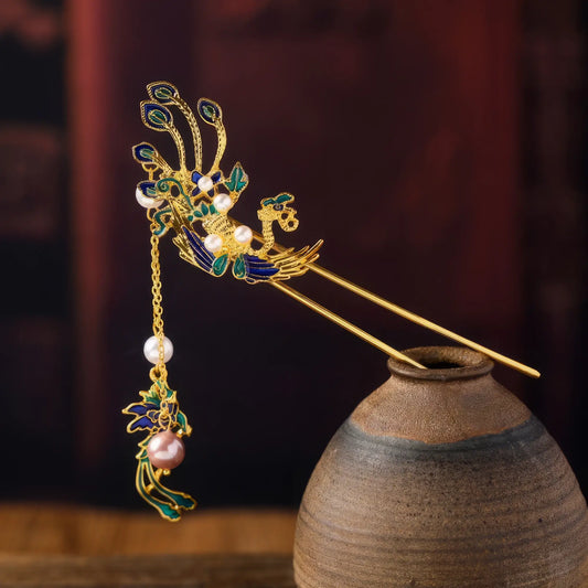 Side view of the phoenix travel hairpin, showing the details of the tassels and three - dimensional decorations, on a bamboo background