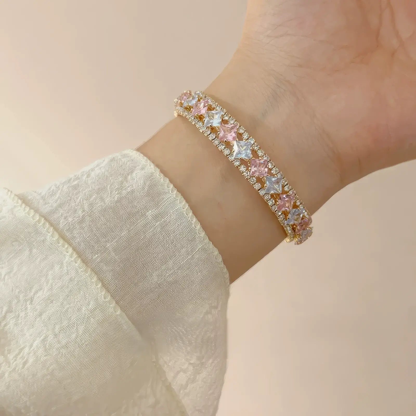 Pink zircon bracelet worn on wrist, showcasing elegance