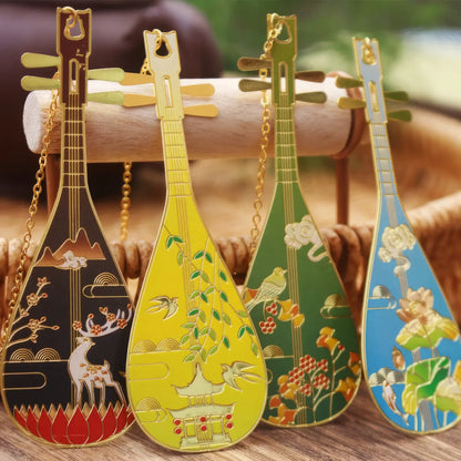 Colorful set of pipa - shaped bookmarks with diverse patterns, placed on a surface, each equipped with a small pendant chain.