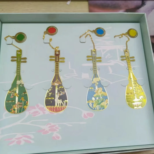 Set of pipa - shaped bookmarks in various colors and patterns, arranged in a light - colored box, each with a small pendant chain.