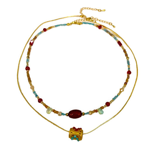 Red agate beaded pendant necklace, isolated on white background, highlighting the double - layer structure and pendant