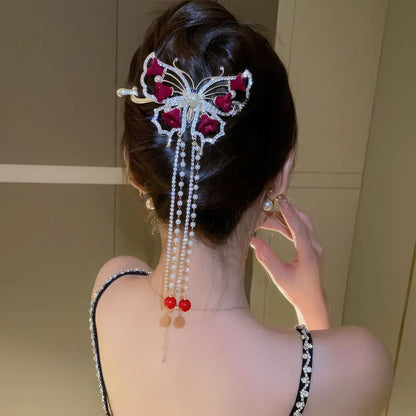 Alternative view of red flower butterfly hair clip worn in updo