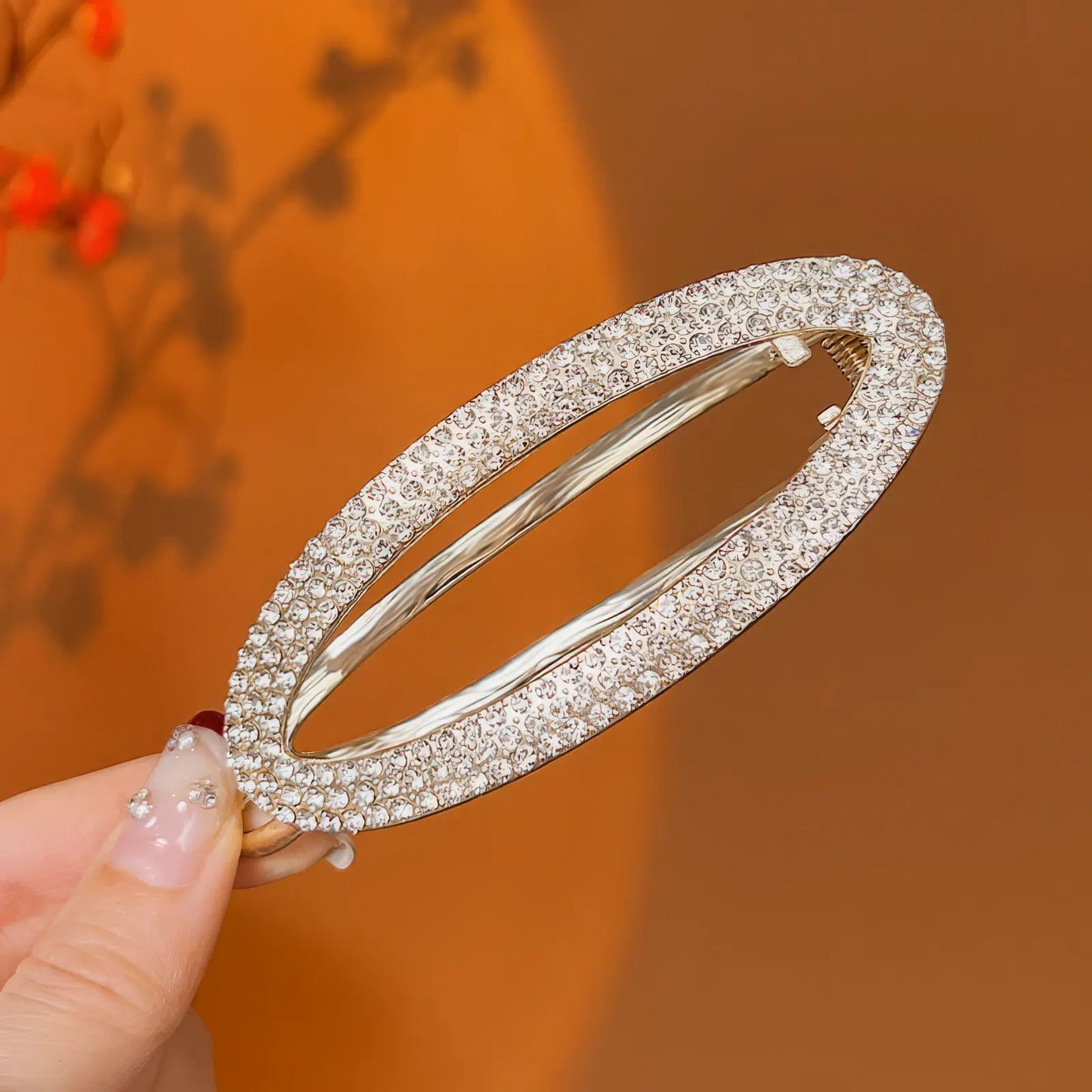 Round - shaped crystal - studded twist hair clip (silver tone)