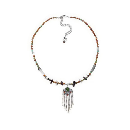Ruyi tassel lock pendant necklace, isolated on white background, highlighting the intricate design
