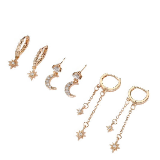 Set of gold star moon chain tassel earrings, isolated on white background