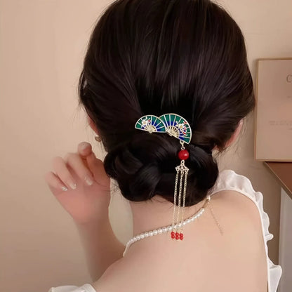 Another view of the tassel buya four - teeth comb (fan - design) worn in an updo hairstyle