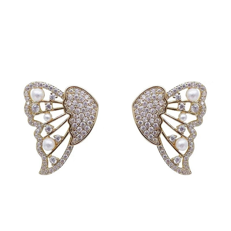 Gold two - way wear butterfly diamond earrings, isolated on white background