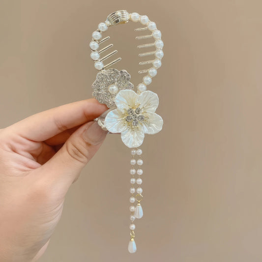 Updo clip with white flower, pearl, and tassel design