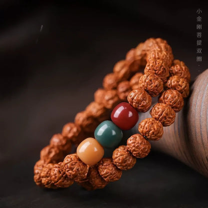 Double - strand vajra bodhi bracelet worn on wrist, showing layering effect