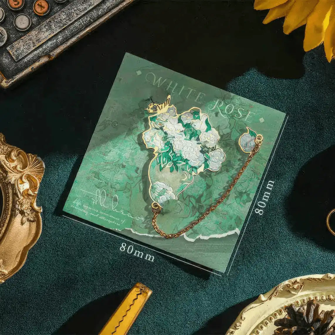 Van Gogh - inspired metal bookmark placed on a small canvas with a painted background, emphasizing the artistic theme, detailed product photography style, 4:3 ratio