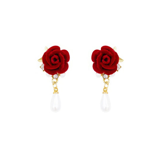 Red velvet rose earrings with pearl drops on white background