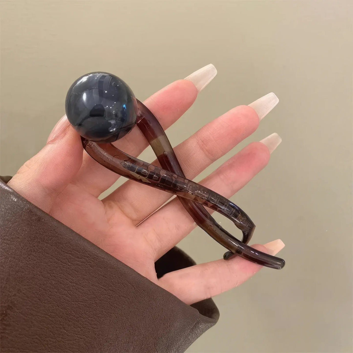 Detail of vintage brown bead twist clip (dark bead)