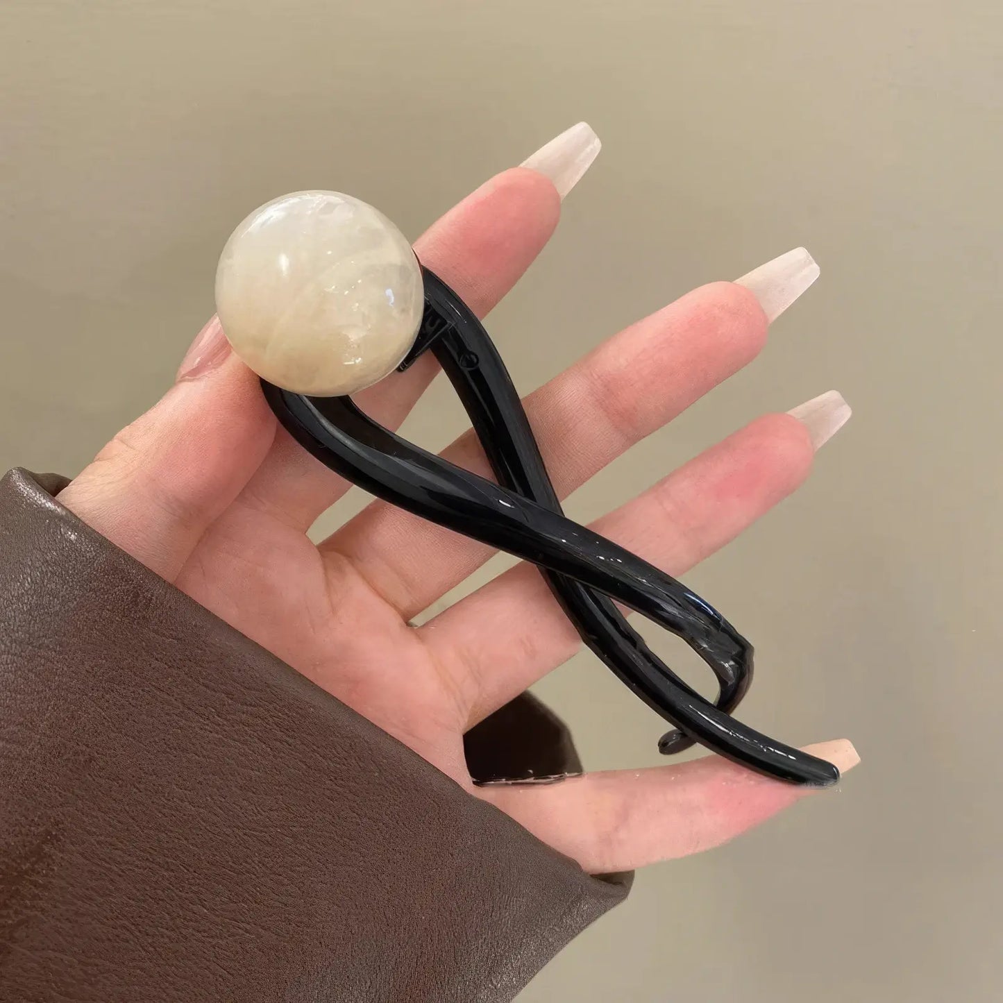 Detail of vintage brown bead twist clip (light - colored bead)