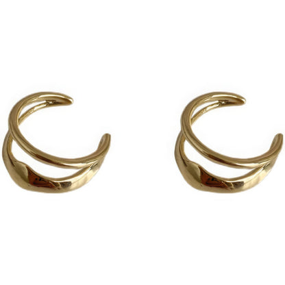 Gold vintage geometric high - end ear cuffs, isolated on white background, showcasing the layered design
