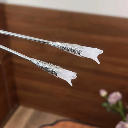 Pair of white magnolia hair pins, isolated on white background, highlighting design