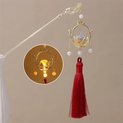 Xiaonianhuadeng hairpin with red tassel and gold lantern, beige background