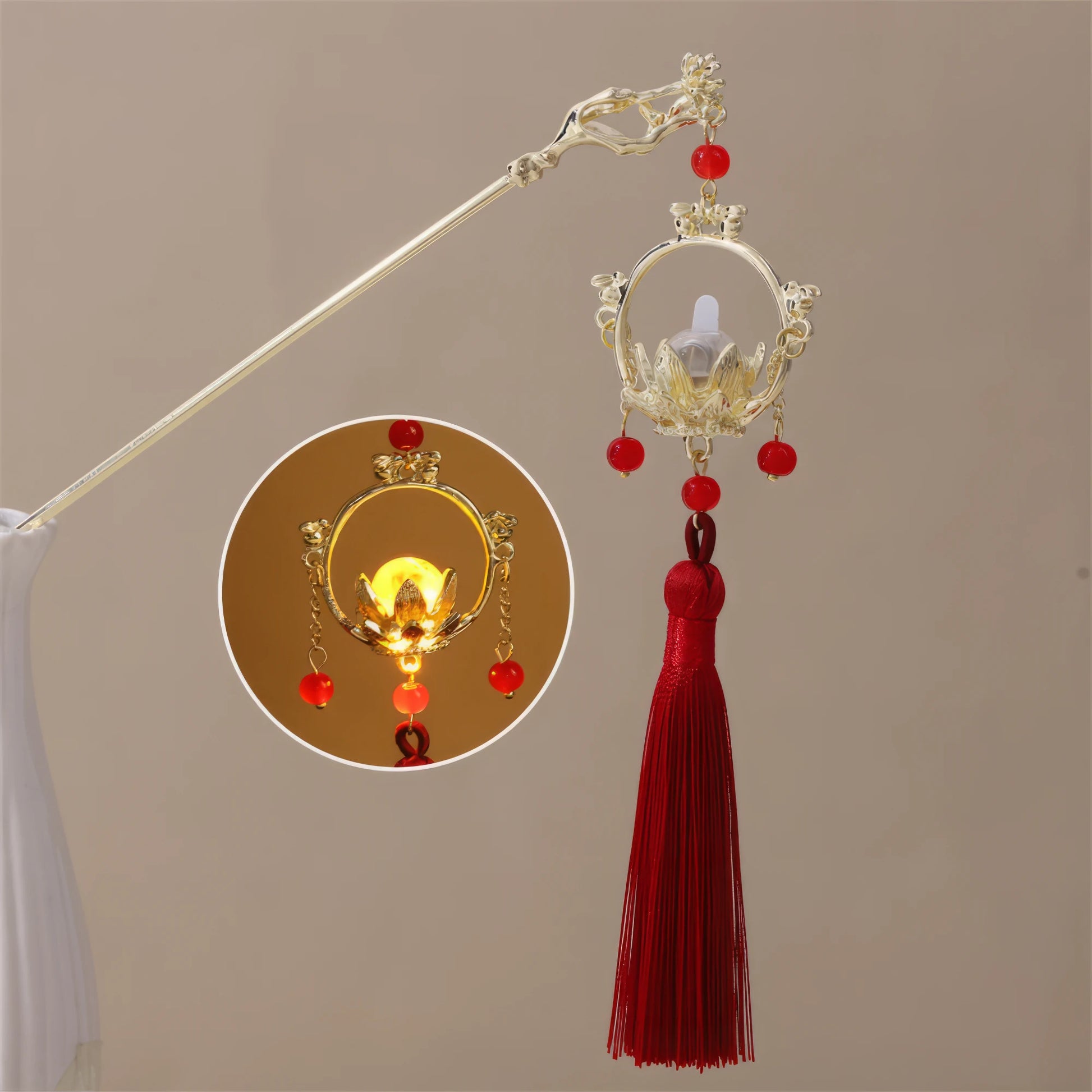 Xiaonianhuadeng hairpin with red tassel and gold lantern, beige background