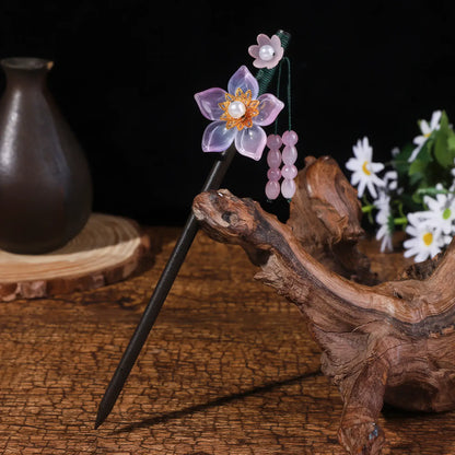Yaotiao hairpin with purple flower and bead tassel, dark background with vase and daisies