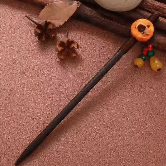 Youqing hairpin with colorful bead decorations, brown background with wooden elements