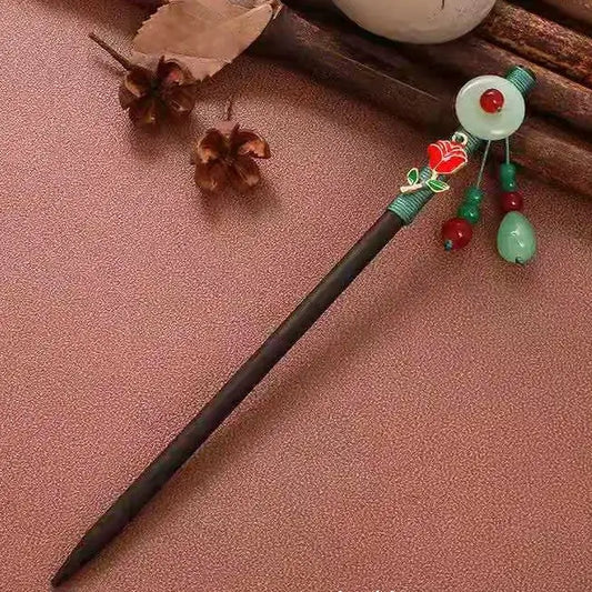 Yuhong hairpin with white circular ornament, green beads, red decorations, brown background with wooden elements