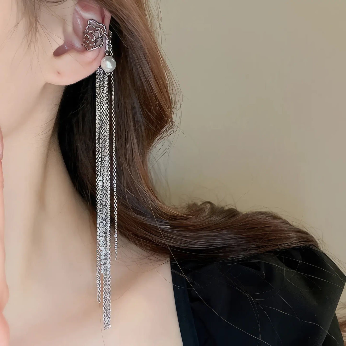 Zircon star - moon tassel ear cuff, multi - chain design, worn on dark top