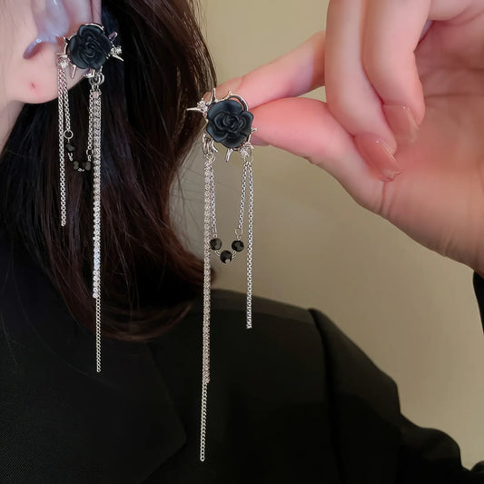 Zircon star - moon tassel ear cuff, black accents, worn on dark outfit